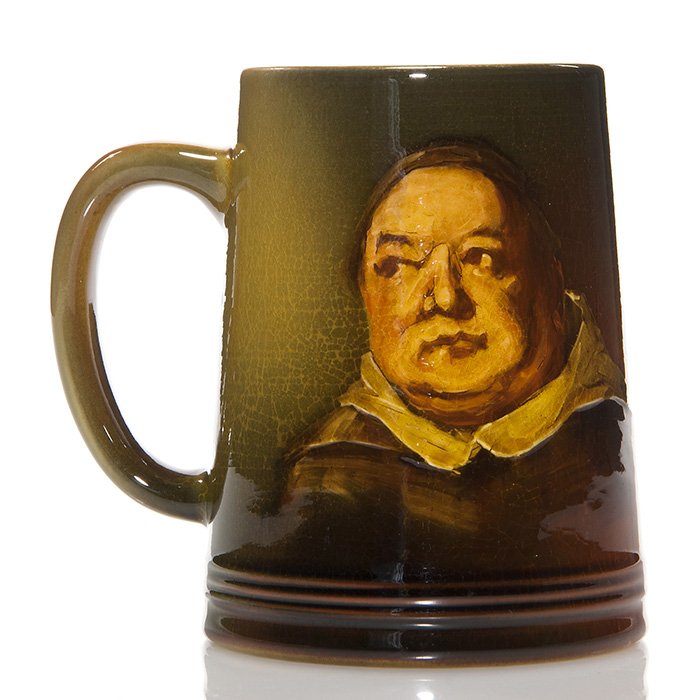 Rookwood Standard,portrait mug, Daly, 1891, 4 5/8”: Standard Glaze 4 5/8 inch mug decorated with the portrait of a monk, done by Matthew Daly in 1891. Impressed with the Rookwood logo, which indicates the date, shape 587, a W for White clay and the art