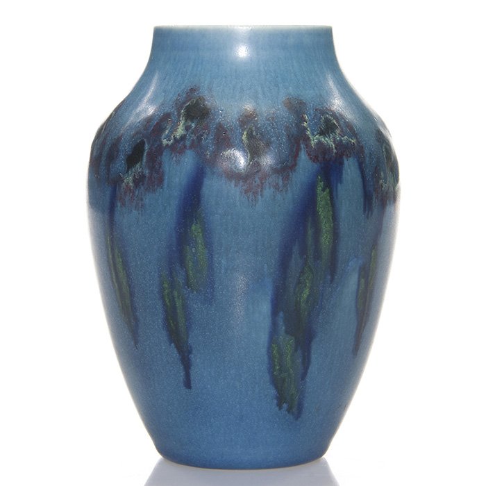 Rookwood mat vase, Todd, 1921, 604 E, 5 3/4”: Mat Glaze 5 3/4 inch vase with colorful flowers encircling the vessel at the shoulder set against a blue ground, the work of Charles Todd in 1921. Marks include the Rookwood logo, date, shape 604E and