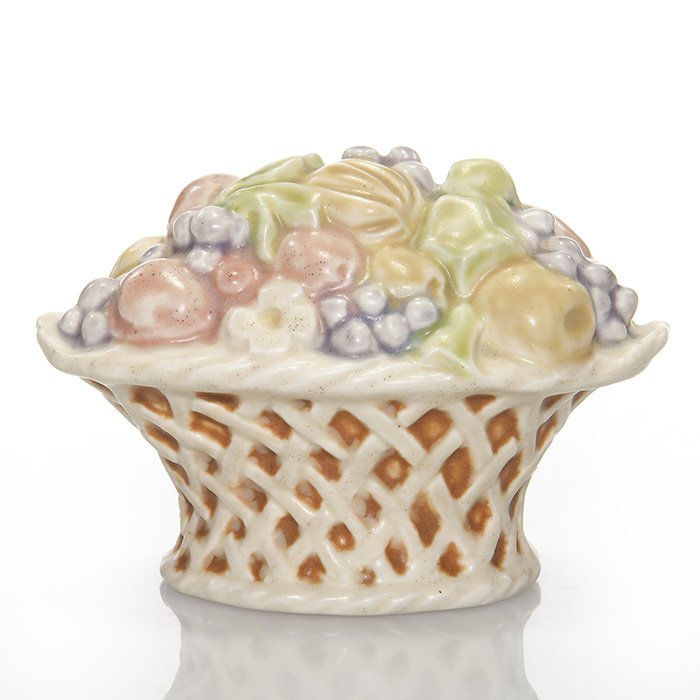 Rookwood Polychromed fruit basket PW, 3 1/8”: Fruit Basket paperweight, a Sallie Toohey design, cast in 1927 and decorated with six mat glazes. Marks include the Rookwood logo, date, shape 6020 and Ms. Toohey’s mold monogram. There is very mino