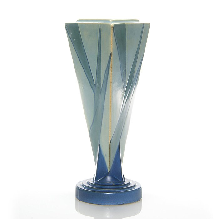 Roseville Futura vase, shape 388-9”, 9 1/8”: Roseville Futura Triangle vase in blue, shape 388-9”. Unmarked. There is a tiny nick at the top of the plinth. Height is 9 1/8 inches.