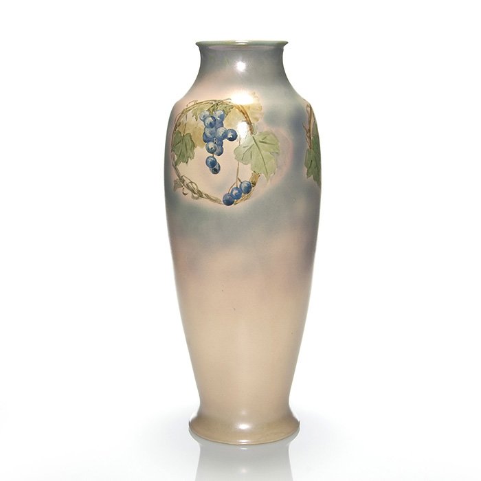 Large Roseville Pauleo vase, grapes, 18 3/4”: Monumental Roseville Pauleo vase hand decorated with pods of blue grapes within a wreath of foliaged vines repeated three times about the shoulder and set against a cream and blue gray backdrop with a