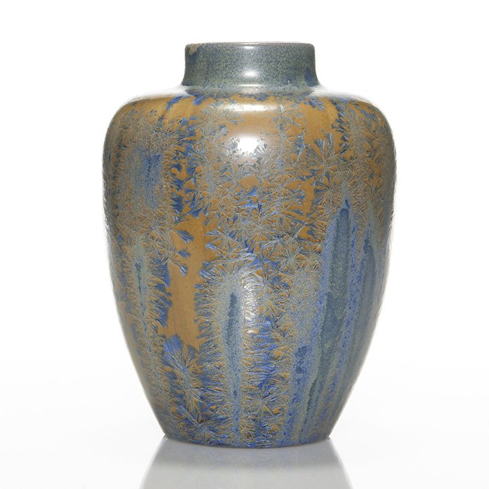 Flint Faience crystalline vase, 8 1/2”: Flint Faience crystalline glaze vase. Height 8 1/2 inches. Nice blue crystals glide over a butterscotch glazed backdrop. Heavy clay body. Unmarked. Similar vase is pictured in Carney & Galvas “Flint