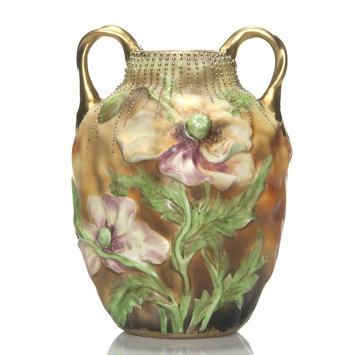 Nippon blow-out vase, handles, poppies, 8 1/2”: Nippon handled blow-out vase with highly raised poppies on a colorful square organic form. Decorative gold beaded necklace at the rim. Height 8 1/2 inches. Blue stamped “Nippon, Hand Painted” with