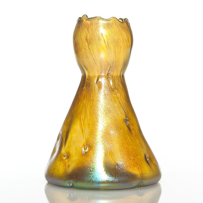 Loetz vase, Candia Silberiris Astartig, gold, 7 3/4”: Loetz “Astartig” vase, the Silberiris surface gleaming in blue, green and gold, the likeness of a ladies gown, the bodice with fine scalloping. Measures 7 3/4 tall and 5 1/2 inches across the base