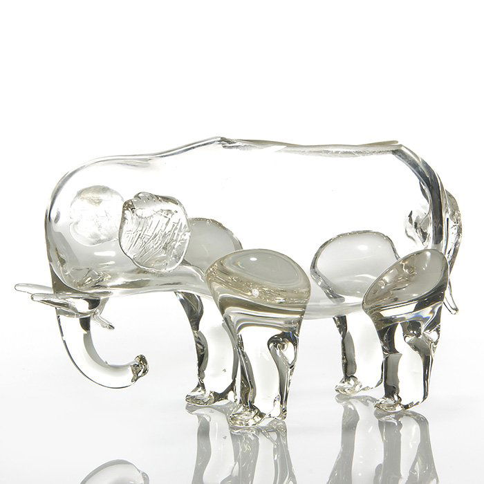 Loetz Czechoslovakia clear elephant,6” X 11”,marked: Loetz Czechoslovakia clear glass elephant with the application of legs, tusks and crinkly ears and having a cut out opening on his back. Measures 6 inches tall by 11 inches in length. Faint acid stamp