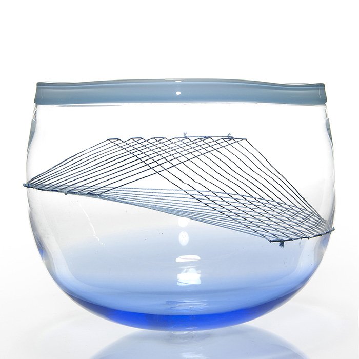 Richard Rackham sculpture, threaded bowl, 7 1/4”: Swedish artist Richard Rackham sculpture combining a weave of threading laced within the sides of a glass bowl. Measuring 7 1/4 inches by 8 1/4 inches across the triangular rim. Engraved “R, Rackham