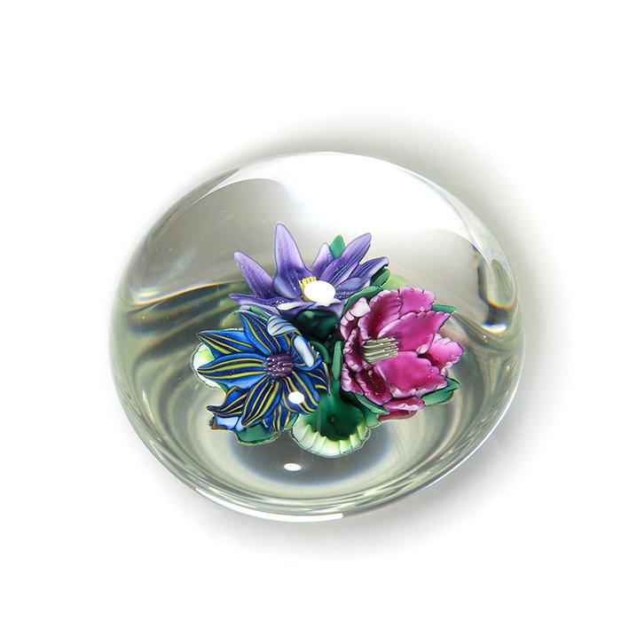 Ken Rosenfeld paperweight, 3 Clematis, 2 3/4” dia: Early Ken Rosenfeld paperweight revealing a colorful bouquet of clematis blossoms and a few leaves preserved at the peak of bloom. Measures 1 7/8 inches by 2 3/4 inches in diameter. Engraved “Ken Ro