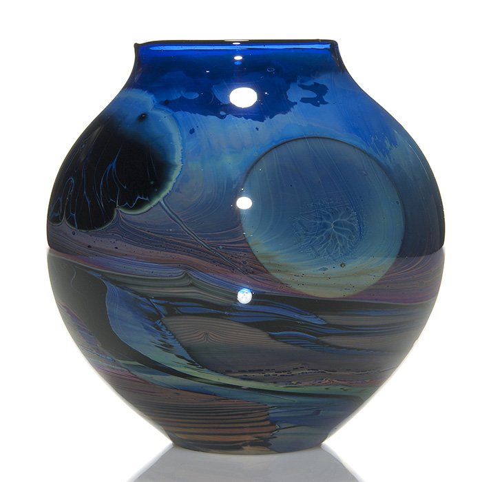 Early John Lewis “Moon” vase, 6 1/4” , 1976: Early John Lewis 1976 vase with double “Moons” above a wonderful atmospheric landscape, a nice layering effect with a compatible mingle of colors. Measures 6 1/4 inches by 7 inches across. Engrave