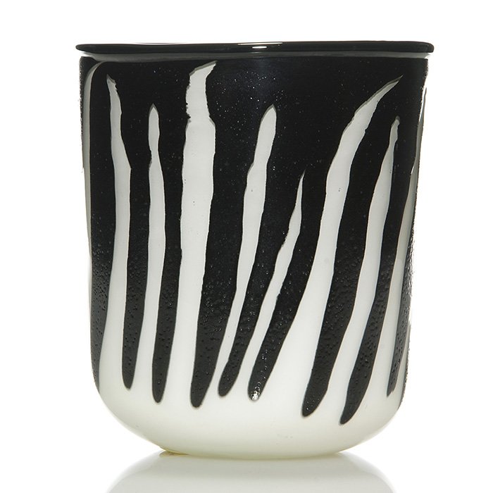 Samuel J. Herman “zebra” vase, 6 1/8”, signed,1971: Early Samuel J. Herman vase displaying black zebra stripes over a cased white cylinder. Measures 6 1/8 inches by 5 3/8 inches. Engraved “Samuel J. Herman” beside the 1971 date. Excellent condition