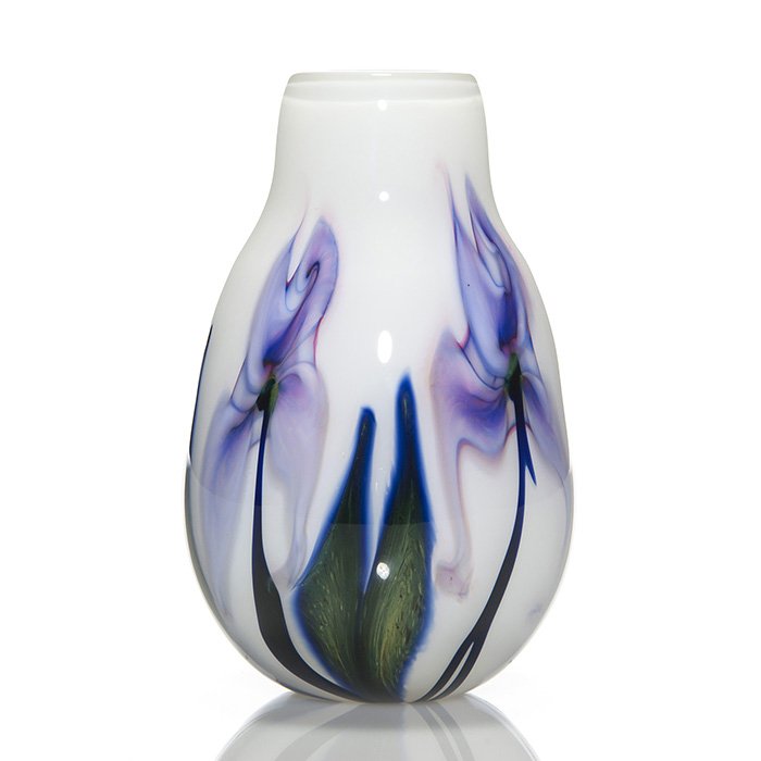 C. Lotton vase, purple irises, white, 5 3/4”, signed: Pretty Charles Lotton Multi Flora vase revealing purple blue “irises” alternating with mottled green leaves over bridal white. Height 5 3/4 inches. Engraved “Charles Lotton, 2009, Multi Flora”