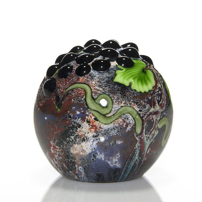 Orient & Flume paperweight, applied grapes, 3 1/4”: Limited Edition Orient & Flume large paperweight created by Ed Alexander aka Ed Seaira. The earth tone sphere has a 3-D grape pod applied with several sneaky snakes visiting the luscious fruit. Measur