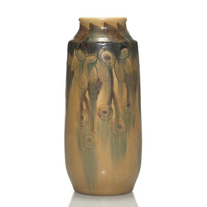 Rookwood floral vase, Todd, 1921, 2061, 7 3/8”: Mat glaze vase with lightly incised leaf and berry design, decorated with red, brown and blue against a tan mat field, the work of Charles Todd in 1921. Marks include the Rookwood logo, date, shape 20