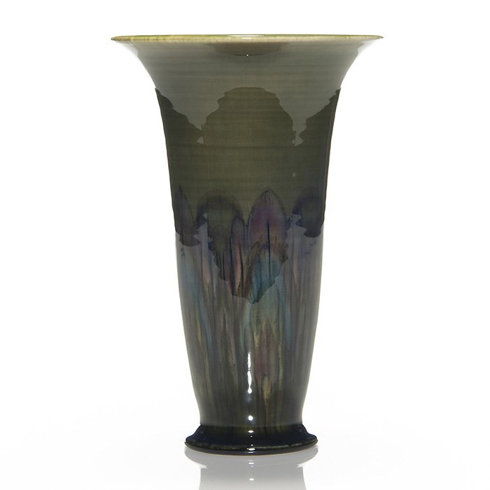 Rookwood Black Opal vase, Sax, 1926, 2734, 8 5/8”: Rookwood Black Opal vase done by Sara Sax in 1926. Pictured are dozens of overlapping spiky leaves in shades of rose , blue and green. The interior of the thrown vase is done in a striated glossy gree
