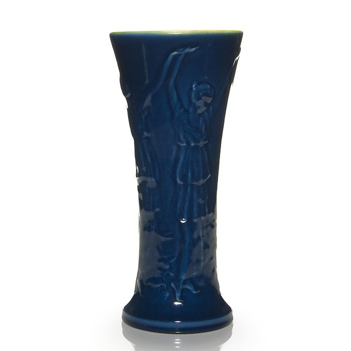 Rookwood vase, dancers, 1921, blue, 13”, 2543: Handsome porcelain production vase designed by Louise Abel and made at Rookwood in 1921. Pictured are four women in diaphanous gowns who appear to be dancing. While the exterior is done in a rich blue