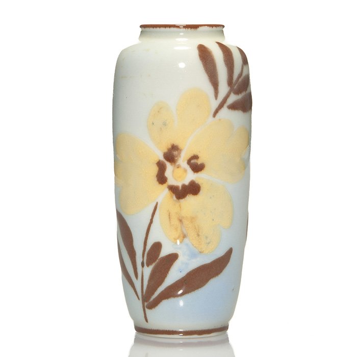 Rookwood Porcelain vase, floral, Barrett, 1945,6 3/8”: Porcelain 6 3/8 inch vase decorated with a pair of brown and yellow flowers against a soft blue ground, the work of Elizabeth Barrett in 1945. Marks include the Rookwood logo, date, shape 6644 E, and 
