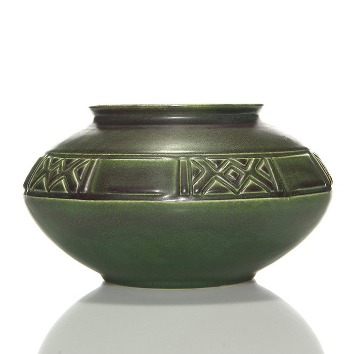 Rookwood hand modeled bowl, 1912, 494 A, 5 1/4”: Hand modeled bowl with a decorative band at the shoulder, produced in 1912 and covered with brown over dark green mat glazes. Marks include the Rookwood logo, date and shape 494 A. There has been a pr