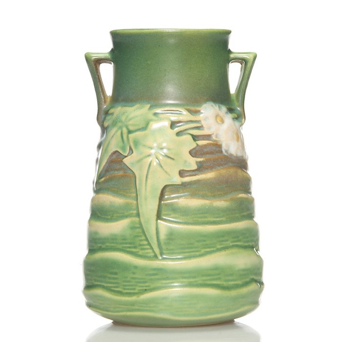Roseville Luffa vase, green, 6 1/4”, shape 683: Luffa tapered vase with a green on shape 683. Height 6 1/4 inches. Mild peppering to a set of flowers. Good color and mold. Excellent condition.