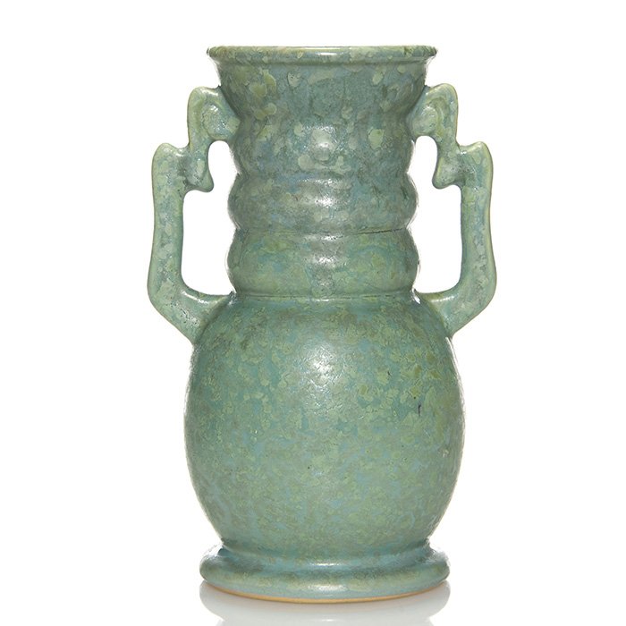 Roseville Carnelian II vase, 8”, turquoise, shape 312: Carnelian II vase with a beehive neck and angled handles under a mottled turquoise glaze on shape 312. Height 8 1/8 inches. Stamped Rv in blue beneath. Small factory glaze protrusion on side. Handsome