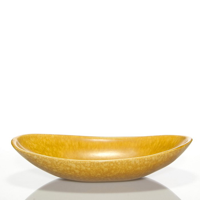 Roseville Raymor bowl, shape 26-16”, 3 3/4” x 17”: Massive Roseville Raymor fruit bowl, shape 26-16”, in gold. Marked on the bottom Raymor Modern Artware by Roseville U.S.A. 26-16”. There is fine overall crazing. Size is 3 3/4 inches high by 17 in