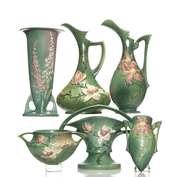 6 items: 3 Magnolia, 2 Clematis, 1 Foxglove, 15 1/4”: Six items in 3 patterns: 3 Magnolia, a hanging planter, a large basket, kiln kiss and glaze skips and a ewer, the tallest at 15 1/4 inches. 2 Clematis, a wall pocket and a ewer. 1 Foxglove vase. Raise