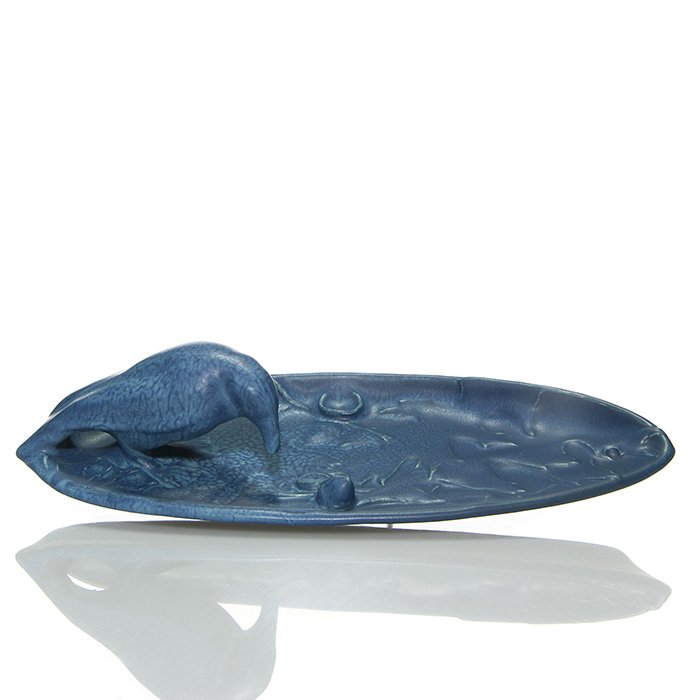 Rookwood Rook-Acorn tray, 1917, 2 5/8 x 10 5/8”: Uncommon “Rook and Acorn” card tray done in a rich, mottled, blue mat glaze in 1917. Marks include the company logo, the date and shape number 2024. Height is 2 5/8 inches and width is 10 5/8 inch