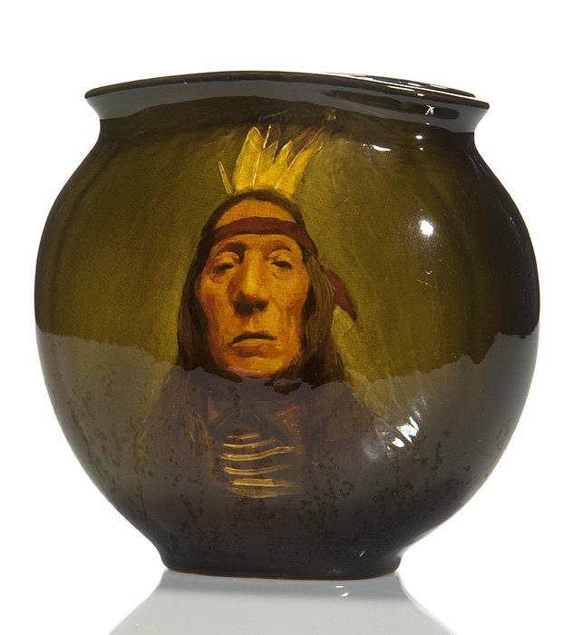Rookwood Standard Indian, Young, ‘98, 9 3/4”: Grace Young Native American portrait of Hidatsu Chief, Lean Wolf, done on a pillow vase at Rookwood in 1898. Young has been generous with Lean Wolf’s visage as age had not been kind to his features,