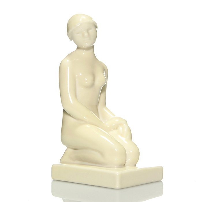 Rookwood Kneeling Nude bookend, 1930, 6 7/8”: Single “Kneeling Nude” bookend, a Louise Abel design, cast in 1930 and covered with a glossy Ivory glaze. Marks include the Rookwood logo, date, shape 6159 and Ms. Abel’s mold monogram. Uncrazed