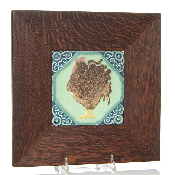 Framed Rookwood Rooster trivet, 1925, 6 1/8” sq: Framed Rookwood “Rooster” trivet done in mat glazes in 1925. Marked with the company logo, the date, shape number 3208 and a wheel ground X. Size is 6 1/8 inches square. Newly framed. The trivet i