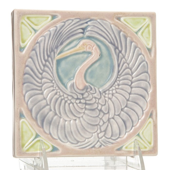 Rookwood “Crane” trivet, 1922, 2047, 5 1/2”: Rookwood “Crane” trivet done in rich pastel colors in 1922. Marks include the company logo, the date and shape number 2047. Size is 5 1/2 inches square. Uncrazed but with some tiny peppering.