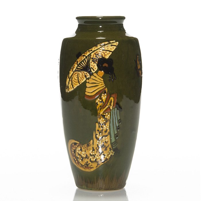 Weller Rhead Faience vase, geisha, 7 7/8": Weller Rhead Faience vase with geisha holding umbrella along with butterflies and one mosquito like creature. Marked Weller Rhead Faience on the bottom and signed by the artist (HA?) on the side. Heig