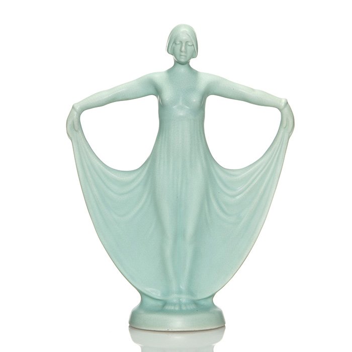 Weller Hobart woman vase, 10 3/4”: Weller Hobart woman vase covered in a soft blue mat glaze. There is the majority of an original Weller Hobart Ware paper label affixed to the bottom, otherwise unmarked. Height is 10 3/4 inches. There