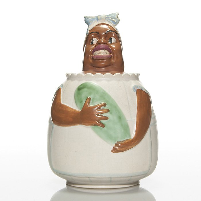 Weller “Mammy” cookie jar, 11 1/4”: Weller “Mammy” cookie jar with incised “Weller Pottery Since 1872” on the bottom. There has been professional repair to a chip on the rim of the lid and there is fine overall crazing. Height t