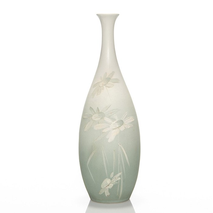 Rare Owens Alpine vase, daisies, 13 3/4”: Rare Owens Alpine vase decorated with daisies done in heavy slip. Marked on the bottom Owens, 2 and 1119. There are a couple of tiny glaze nicks but otherwise in excellent original condition. Height i