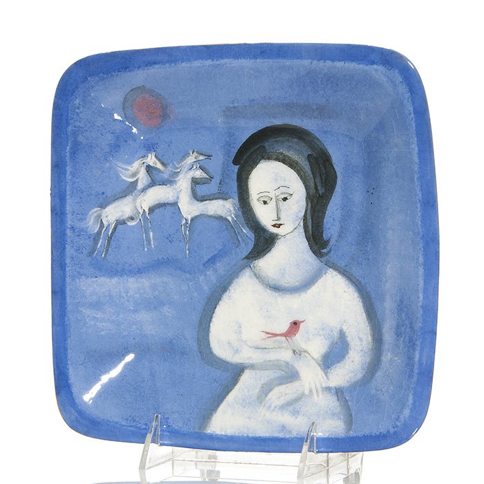 Blue Pillin tray, woman, sun, horses, 9”: Polia Pillin 9 inch square plate decorated with a woman in a white dress holding a red bird and a group of white horses beneath a red sun, all set against a blue ground. Marked on the bottom Pillin in