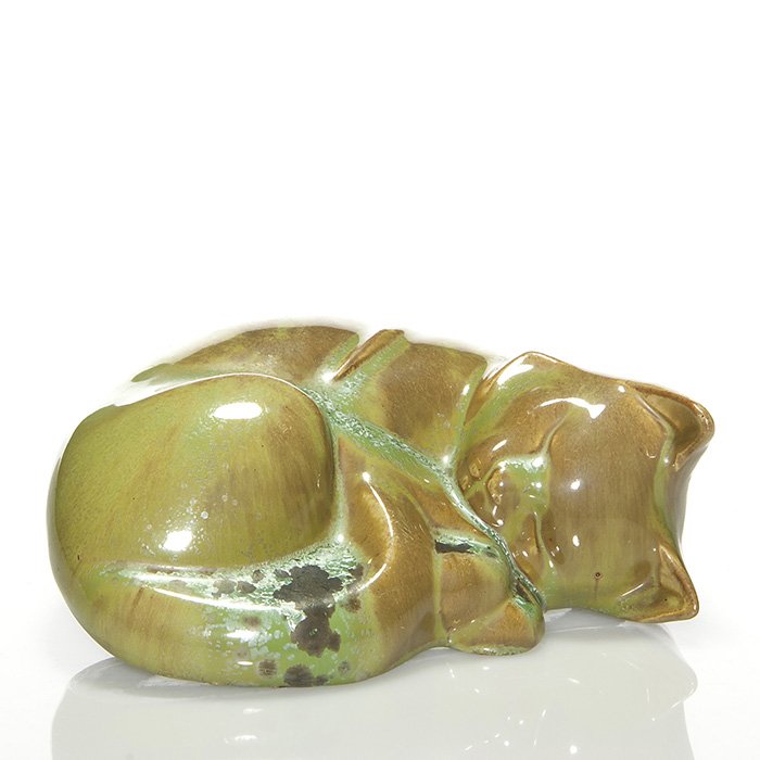 Fulper “Sleeping Cat” figural, 3 1/8 x 8 1/2”: Uncommon Fulper “Sleeping Cat” figural done in Leopard Skin crystalline glaze. Fulper oval ink stamp logo on the bottom. Height is 3 1/8 inches and length is 8 1/2 inches. Excellent original condi
