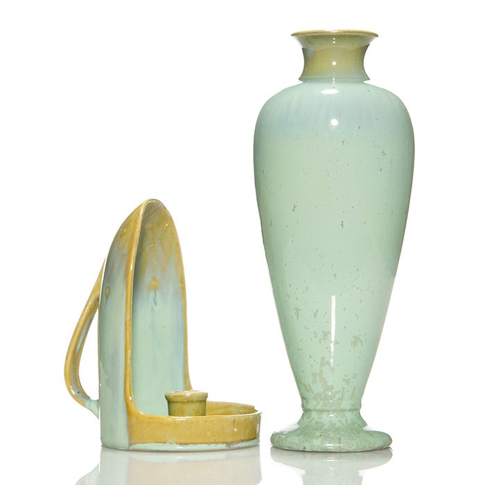 Fulper Hooded candle holder & vase, flambe”, 7 1/4”: Fulper Pottery hooded candle holder in a mustard colored glaze over which a light green flambe’ glaze has been applied. Marked with the Fulper “racetrack” ink stamp. Some crazing and several tin
