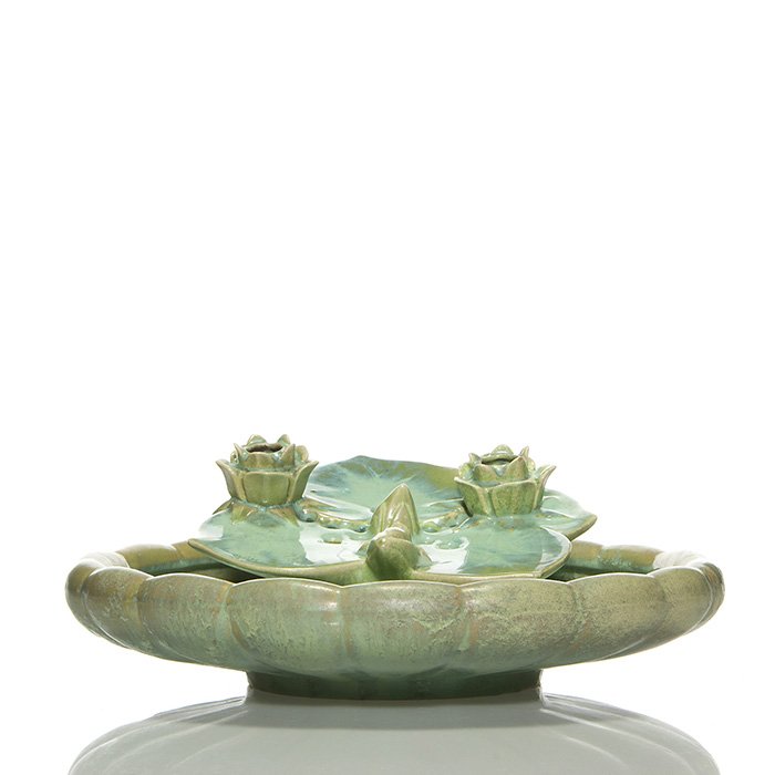 Fulper low bowl and “lily” flower frog, 3” x 15”: Fulper Pottery low bowl and “lily” flower/candle holder both covered in a light green flambe’ glaze, the bowl with a mustard color glaze underneath, the flower frog a medium green. The bowl is 3
