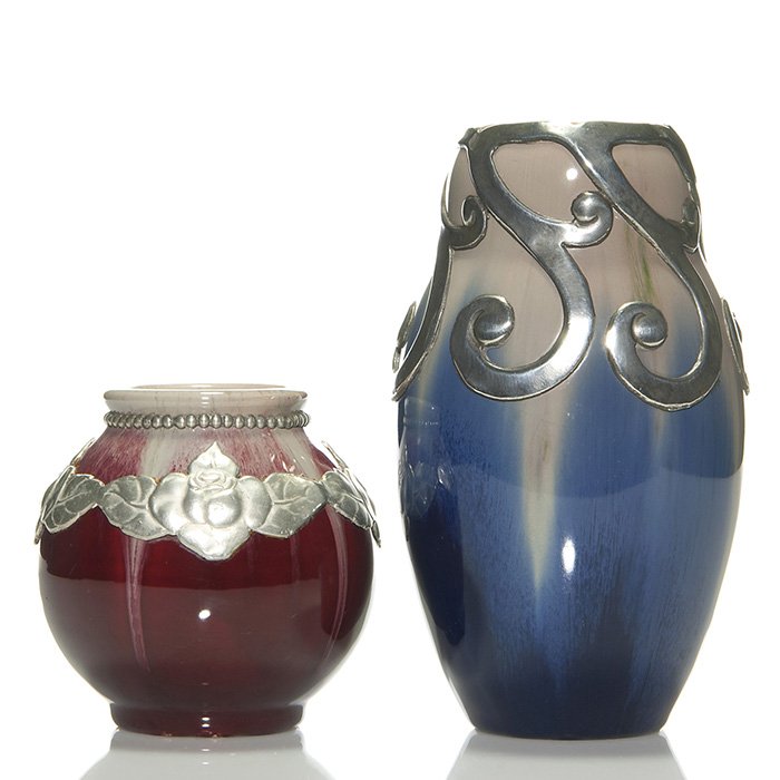 2 Michael Andersen vases, pewter trim, 4 1/8, 7 1/2”: Two Michael Andersen & Sons of Denmark vases trimmed with pewter overlay over thick bi-color glazes. The vases measure 4 1/8 inches and 7 1/2 inches. Each are impressed “MA&S, Denmark” with incise