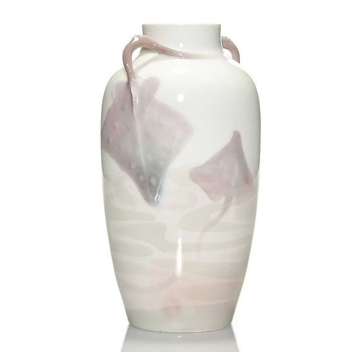 Rorstrand vase, skates, waves, NL, 8 3/4”: Carved and painted Rorstrand (Sweden) porcelain twin handled vase with pink skates negotiating undulating green waves. Two of the skates tails are dimensional and actually are formed to create the twi