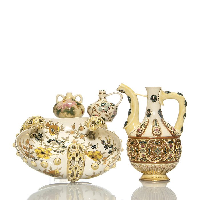 4 pieces Zsolnay ,early reticulated pitcher, 8”: Four pieces of Zsolnay. 1) Early Zsolnay pitcher with reticulated waist band and oval pendants and gleaming with gold accents. Height 8 inches. Unfired gold was applied to the spout. All over crazing.