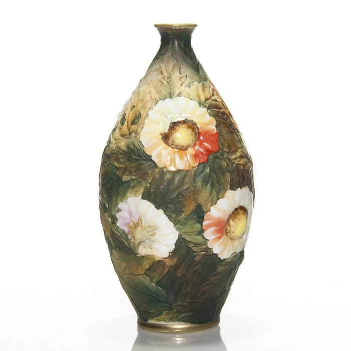 Nippon blown out vase, sunflowers, 9 7/8”: Colorful Nippon blown out vase with three dimensional sunflowers. Marked with the maple leaf “Hand Painted Nippon” ink stamp (Van Patten number 52.) Height 9 7/8 inches. Strong colors and nice sha
