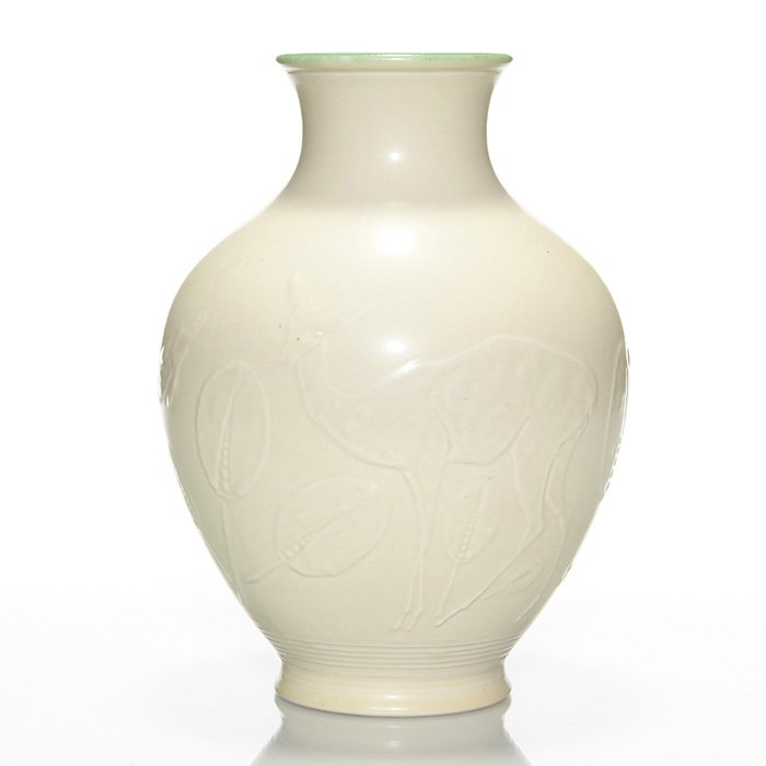 Rookwood production vase, gazelles, 11 1/2”, 6050: Large Production vase with gazelles and leaves, a design by William Hentschel, cast in 1928 and covered with an ivory mat glaze with a shiny sea green interior. Height 11 1/2 inches. Impressed with th