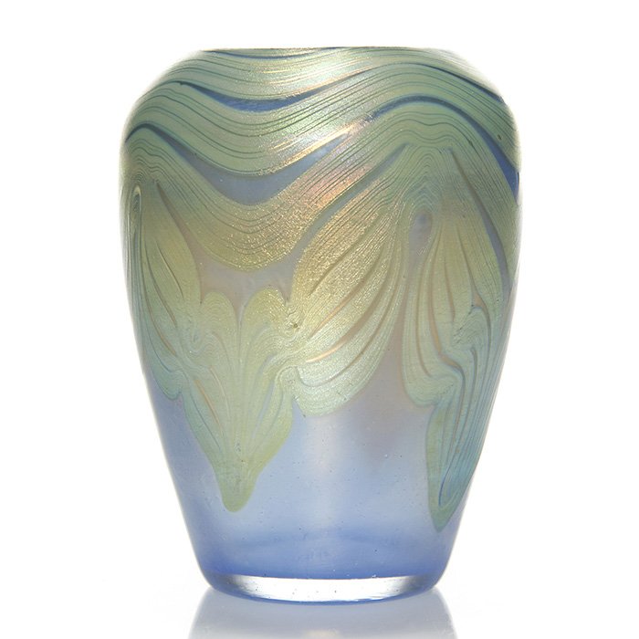 Loetz Phanomen mini vase, 3 5/8”, feather, signed: Loetz Phanomen miniature vase with silvery gold designs pulled from the shoulder over dark blue. Height 3 5/8 inches. Engraved “Loetz Austria” in the pontil. Handsome and in excellent condition.