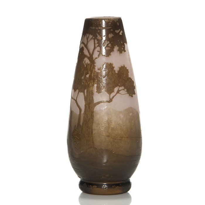 DeLatte cameo vase, 5 7/8”, scenic: Andre DeLatte cameo vase with conifer and foliaged trees and mountains on the horizon done in shades of golden brown over mottled pink. Height 5 7/8 inches. Cameo signed “A. DeLatte, Nancy” on the