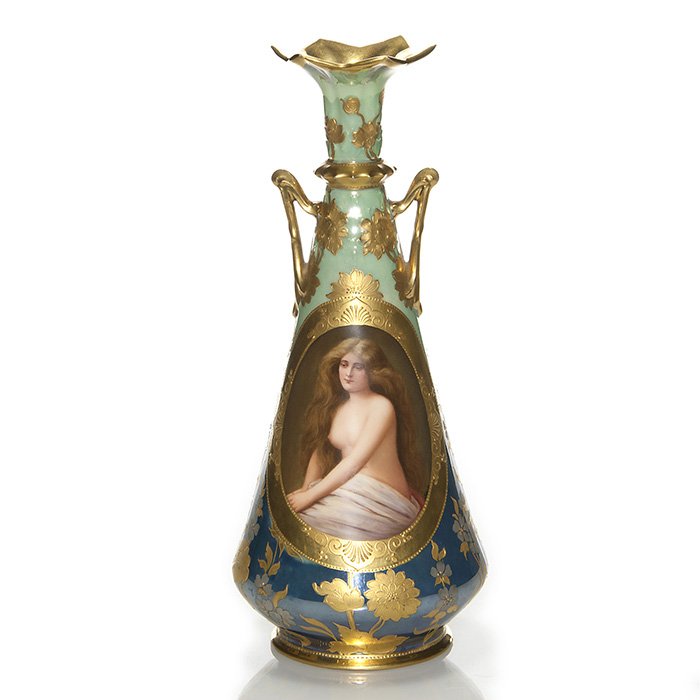 Royal Vienna vase, “Solitude”, Wagner, 11 3/4”: Choice Royal Vienna porcelain vase entitled “Solitude” featuring a half nude maiden with waist length auburn hair framed by an ornate gold band. Signed Wagner on the front. Height 11 3/4 inches. T
