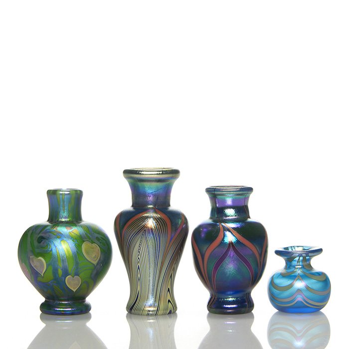 4 Mini vases: 3 Lundberg, 1 Lotton, tallest 3 3/8”: Four early miniature vases, three by Lundberg Studios and one by Charles Lotton. The Lundberg vases in the style of Tiffany with pulled patterns or trailed vines with marquetry foliage, each created b