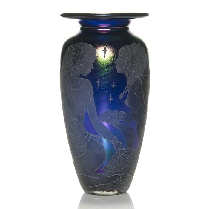 Marialyce Hawke cameo vase, nudes, 10”, signed: Marialyce Hawke cobalt blue cameo vase depicted with doves visiting three nude maidens each grasping hand fans beneath a star and moon lit sky. Height 10 inches. Signed “Hawke” on the side. Engrav
