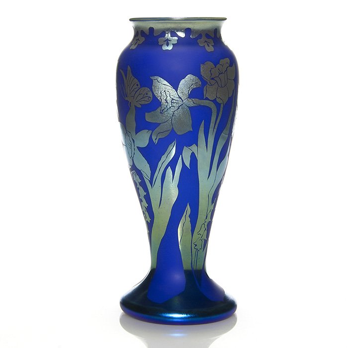 Orient and Flume etched vase, daffs, 10 7/8”, Orme: Early Orient & Flume vase etched by Kathy Orme in 1977 with aurene blue daffodils and Lily of the Valley over a matte cobalt blue ground. Height 10 7/8 inches. Engraved “Orient & Flume, C.1977 A3, K