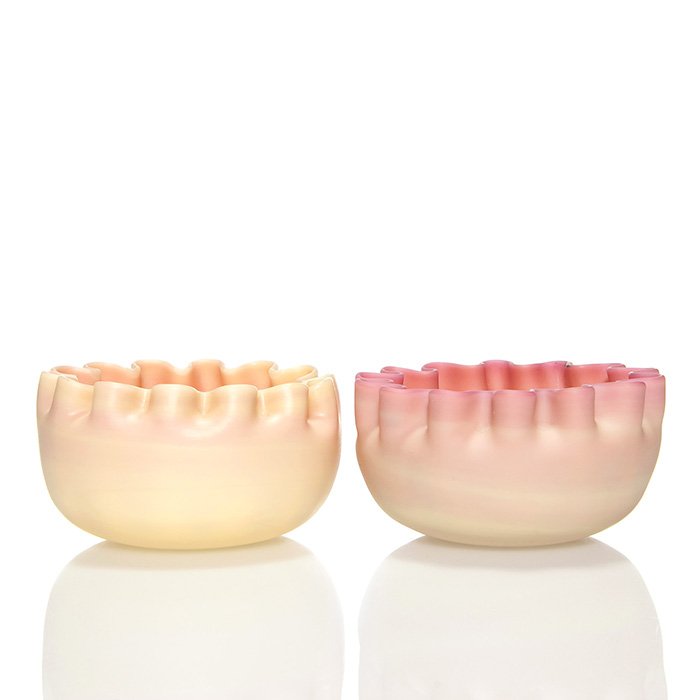 2 Webb Burmese bowls, crimped rims, 2 1/2"X4 3/4": Two Thomas Webb & Sons Queen's Burmese bowls with crimp top rims. Measures 2 1/2 inches by 4 3/4 inches. Both are impressed with the circular QueenÕs Ware logo. Stray color to interior of one. The ot