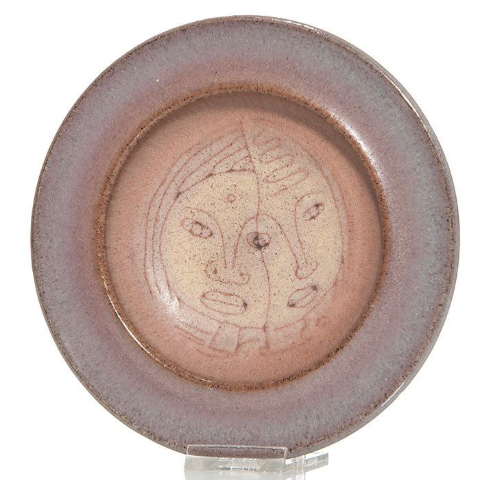 Ed and Mary Scheier mat finish bowl,faces,1"x 6 7/8": Ed and Mary Scheier hand thrown low bowl with painted faces inside bowl. The interior is done in a light green mat glaze with incised lines creating the faces. The underside is done in a gloss finish